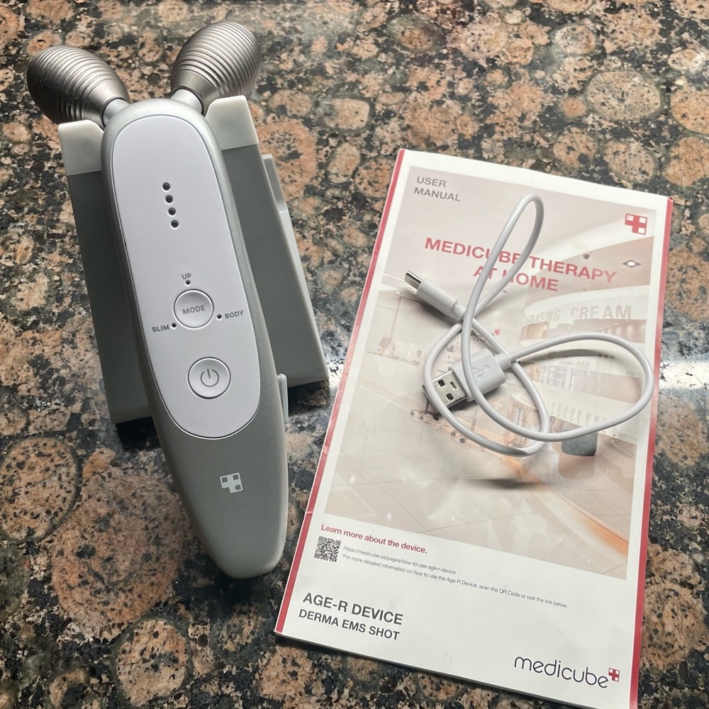 Medicube Age-R Microcurrent Device w/stand and charger cable w/user manual.